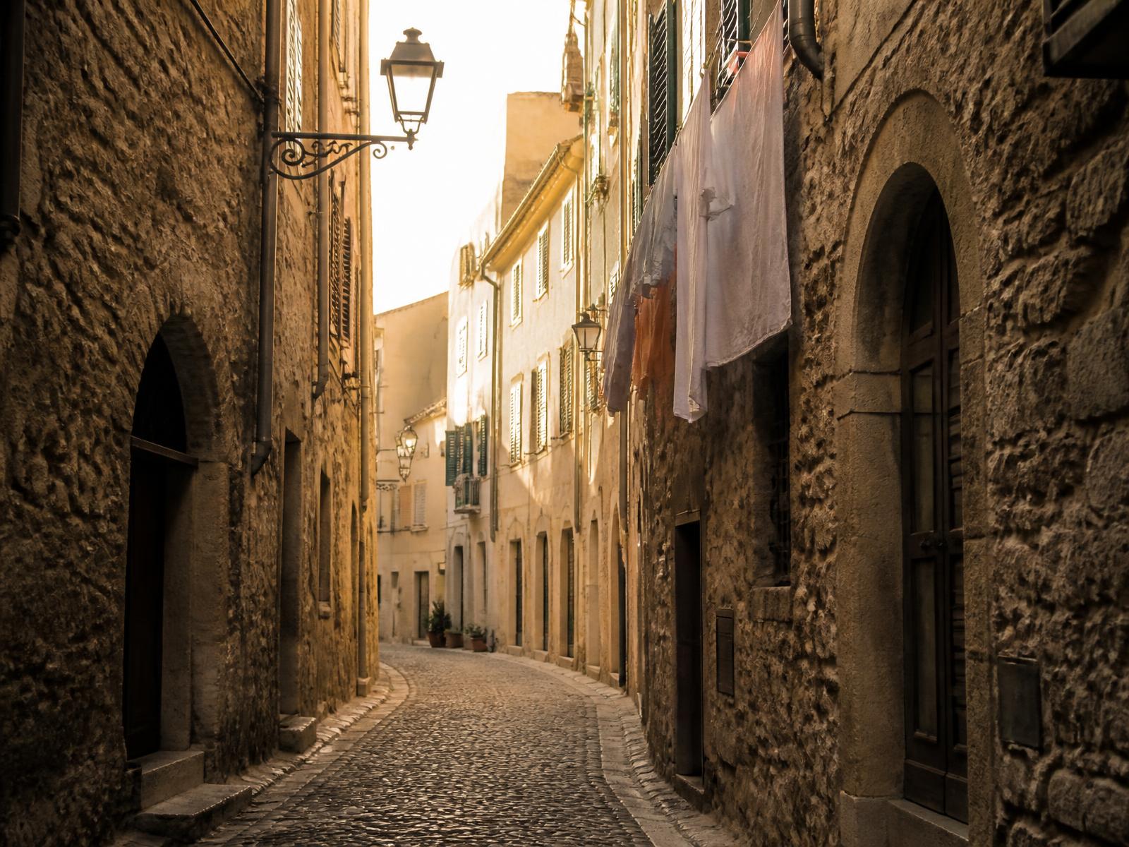 Old stone streets of Alghero in morning light